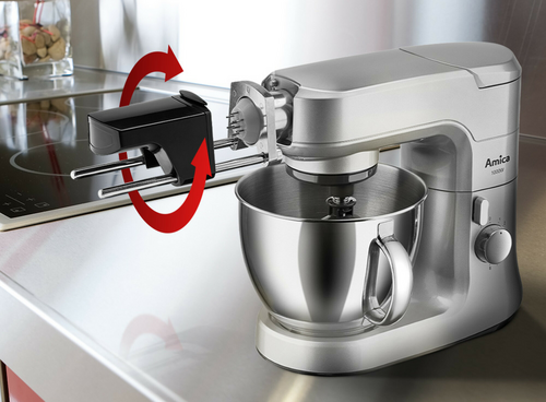 Robot kuchenny planetarny w kolorze srebrnym z misą i maszynką do mięsa. Na obudowie widoczne jest logo \'Amica 1000W\'.