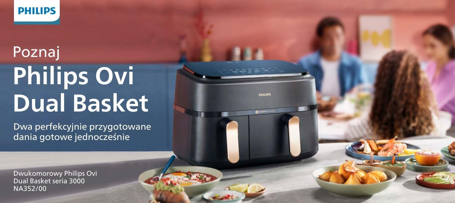 Na obrazie widoczna jest frytkownica beztłuszczowa z podwójnym koszem marki Philips Ovi Dual Basket, umieszczona na stole z różnymi potrawami. Tekst na obrazie: \'Poznaj Philips Ovi Dual Basket Dwa perfekcyjnie przygotowane dania gotowe jednocześnie Dwukomorowy Philips Ovi Dual Basket seria 3000 NA352/00\'.