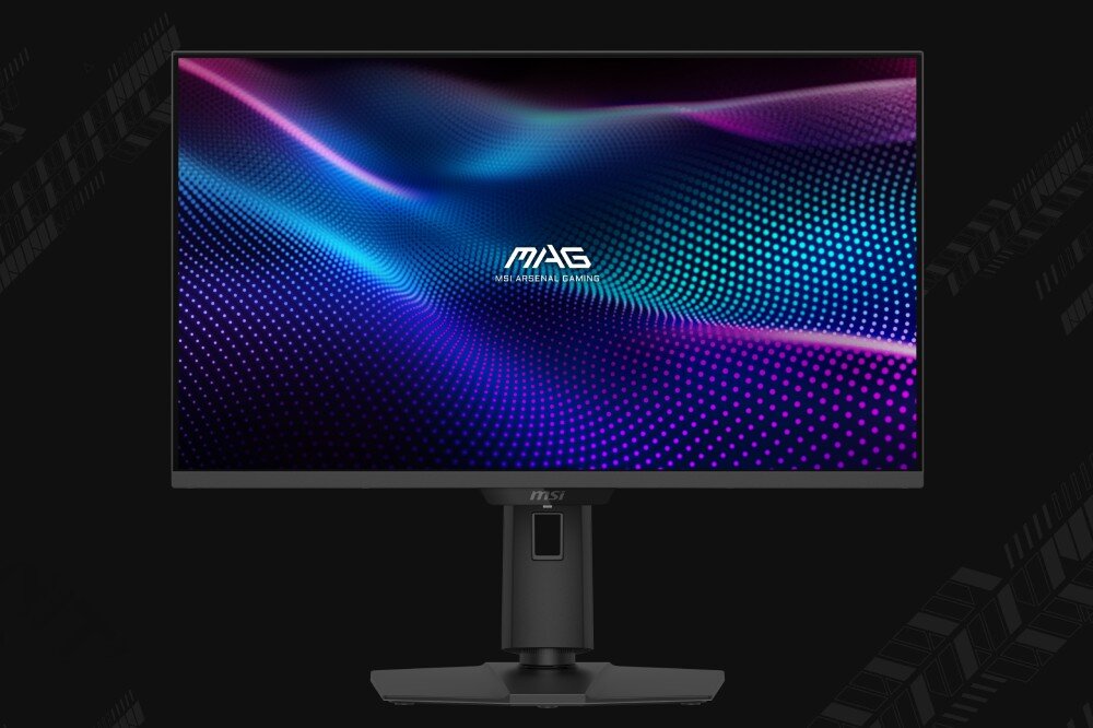 Monitor z wyświetlaczem pokazującym kolorowe fale i logo \'MAG MSI ARSENA GAMING\' na środku. Monitor stoi na czarnym stojaku, a tło jest ciemne.