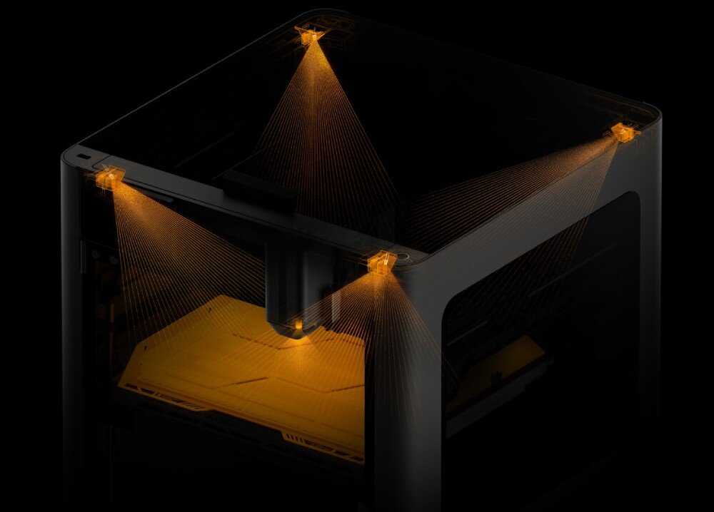 Drukarka 3D BAMBU LAB H2D Laser Full Combo Widok z góry na drukarkę 3D z widocznymi promieniami skanującymi pole robocze