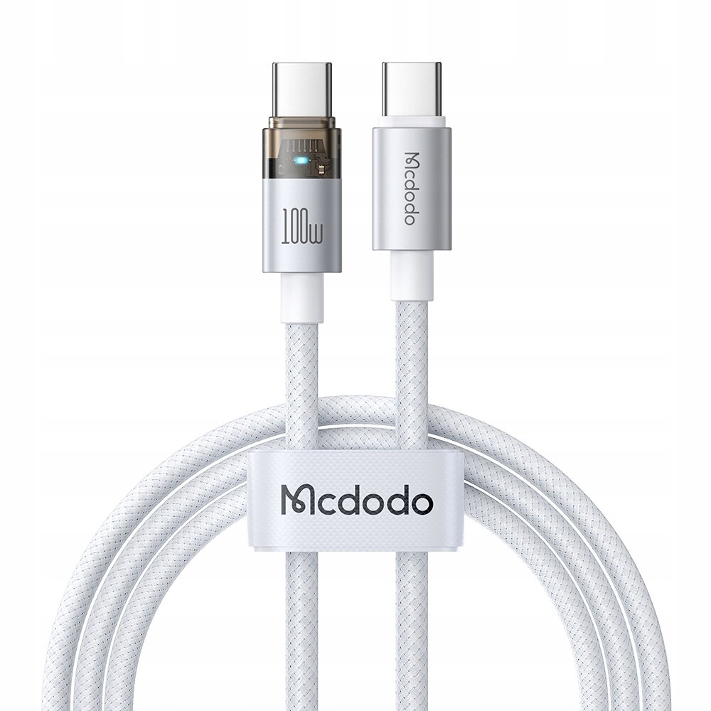 Na obrazie widoczny jest biały kabel USB-C z dwoma złączami, z których jedno ma oznaczenie \'100W\', a drugie \'Mcdodo\'. Kabel jest owinięty opaską z napisem \'Mcdodo\'.