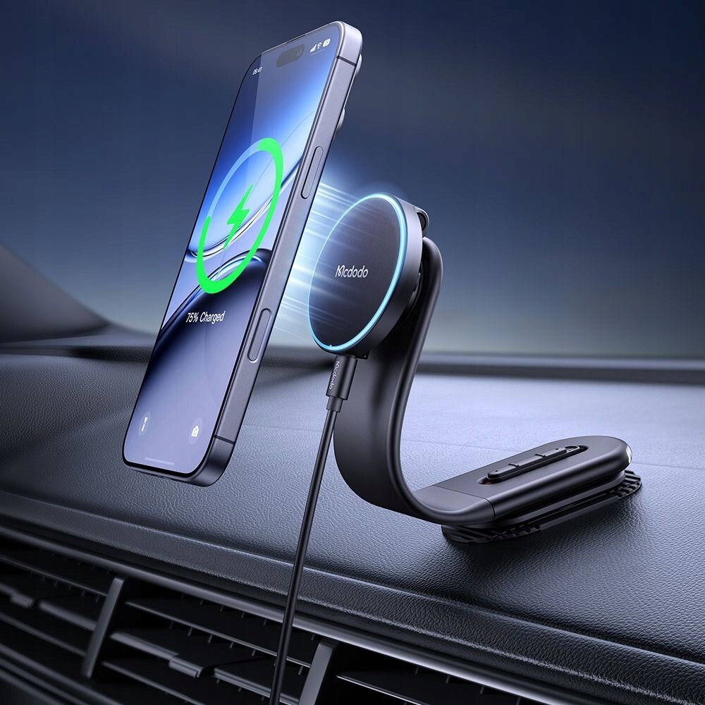 Uchwyt na telefon do samochodu z ładowarką Magsafe zamontowany na desce rozdzielczej, z widocznym logo \'Mcdodo\' na ładowarce. Telefon pokazuje ikonę ładowania z napisem \'75% Charged\'.