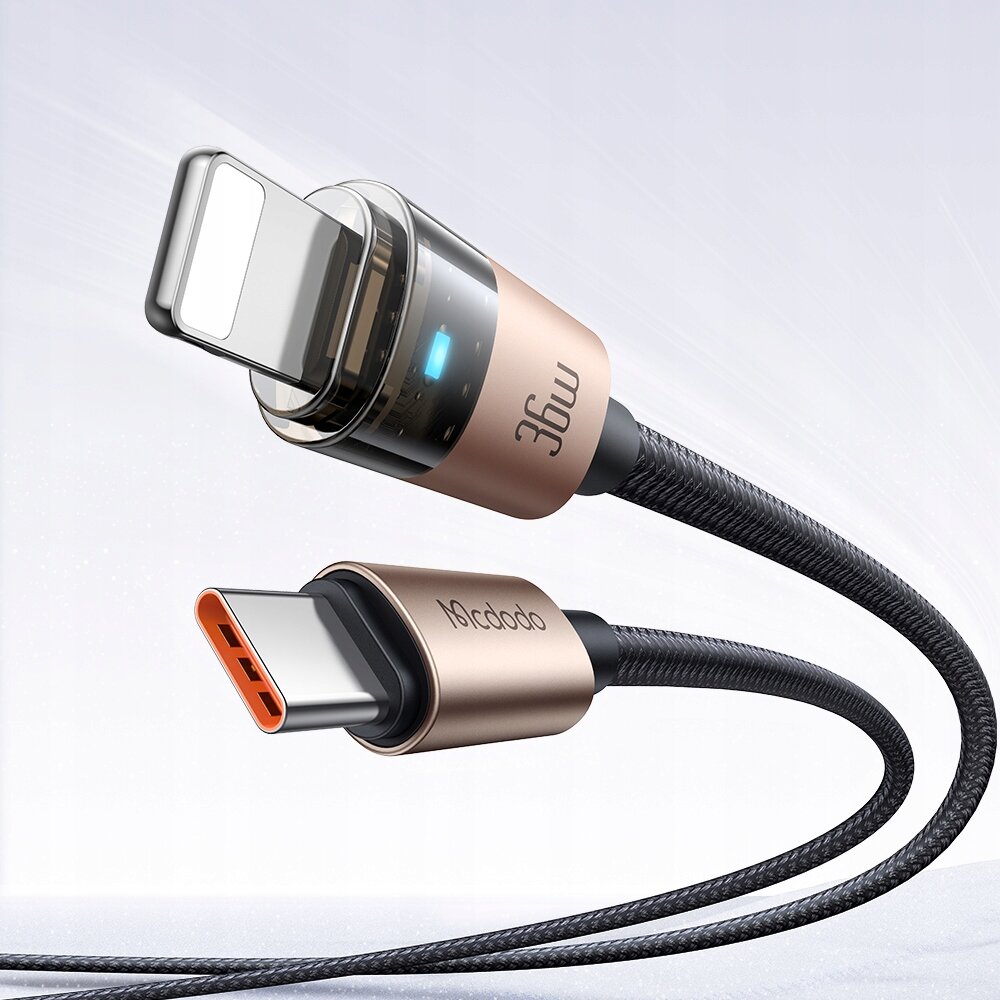Złoty kabel USB-C z końcówką Lightning, oznaczony napisami \'36W\' i \'Mcdodo\', z widocznym niebieskim światłem LED na złączu.