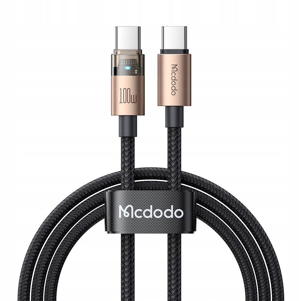 Na obrazie widoczny jest kabel USB-C z dwoma złączami, z których jedno ma oznaczenie \'100W\', a drugie \'Mcdodo\'. Kabel jest opleciony czarnym materiałem i spięty opaską z napisem \'Mcdodo\'.