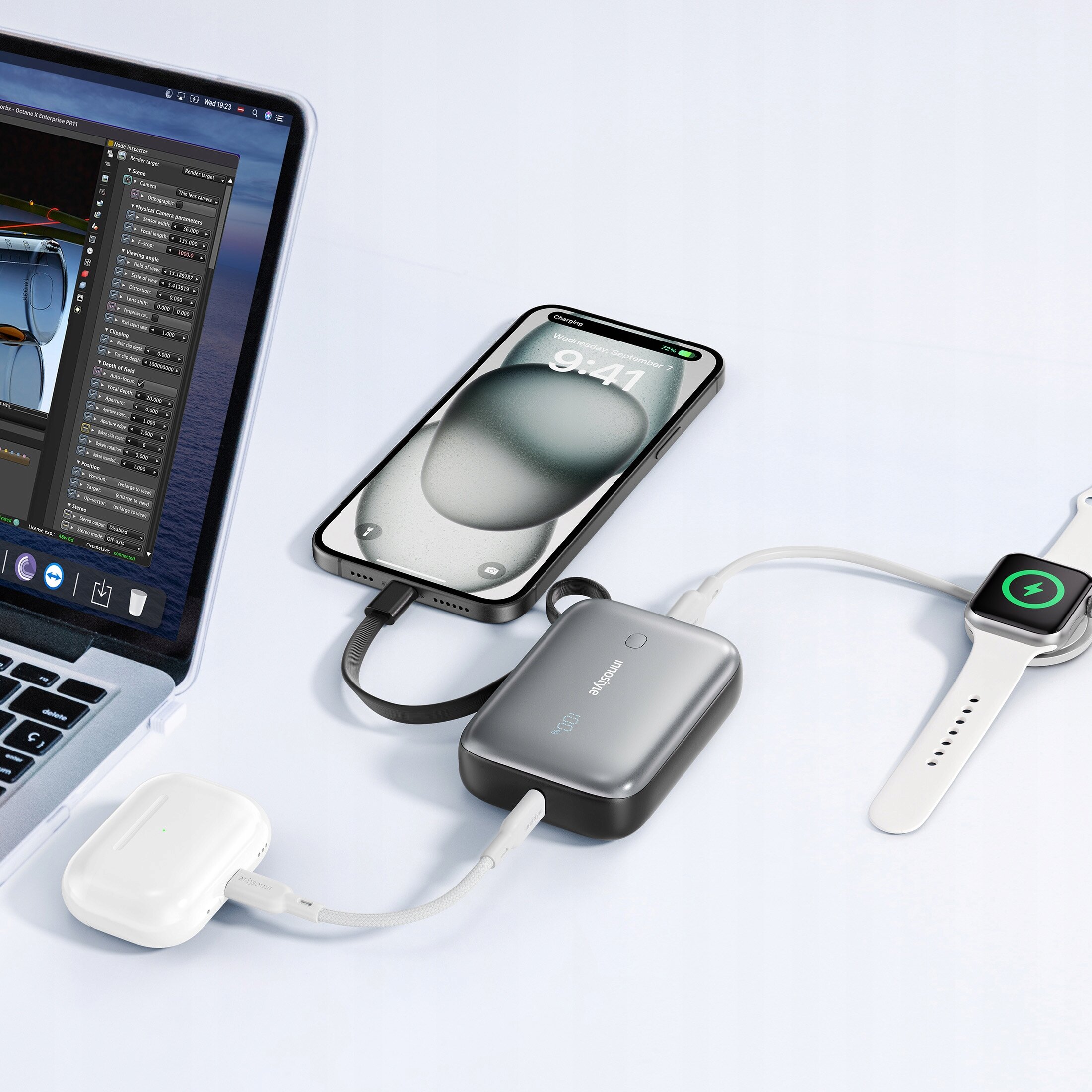 Na zdjęciu znajduje się powerbank Innostyle Powergo Mini Powerbank 10000Mah 3X USB USB-C 22,5W z kablem USB-C, podłączony do laptopa, smartfona i smartwatcha. Na powerbanku widoczne jest logo \'innostyle\'.