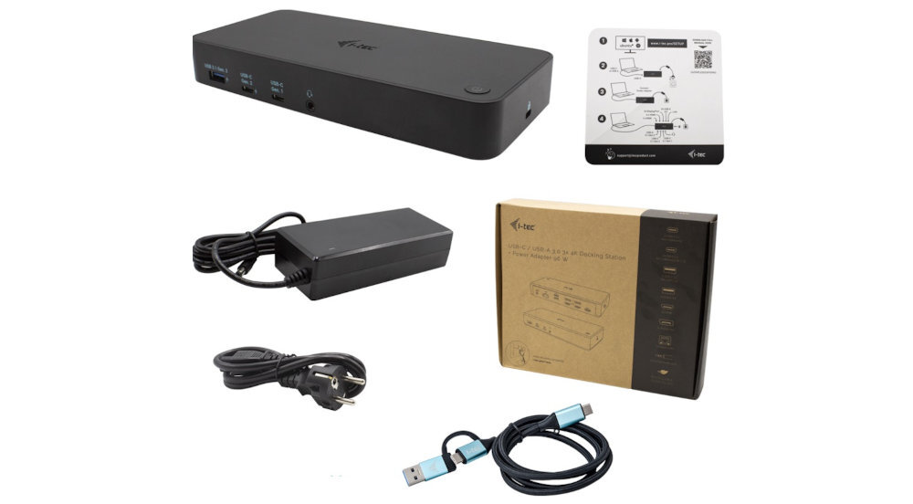 Na obrazie znajduje się czarna stacja dokująca z kilkoma portami USB, zasilacz, kabel z wtyczką oraz kabel USB. Obok widoczna jest instrukcja obsługi i pudełko z logo i-tec.