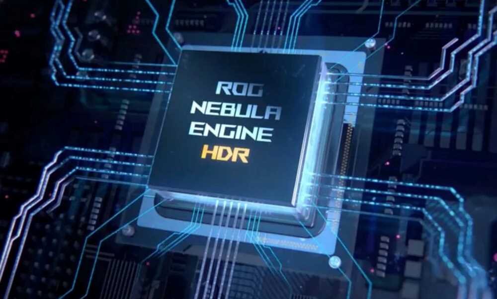 Obraz przedstawia układ scalony z napisem \'ROG NEBULA ENGINE HDR\'. Wokół układu widoczne są niebieskie ścieżki obwodów elektronicznych.