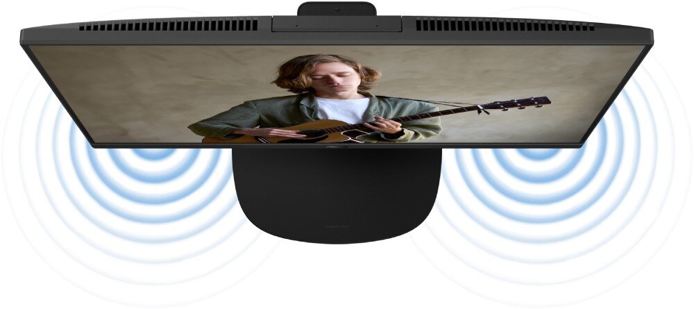 Komputer All in One ASUS VM640KA-BPC019W Komputer All-in-One z kamerą wysuniętą u góry, na ekranie mężczyzna grający na gitarze, a od urządzenia rozchodzą się niebieskie fale