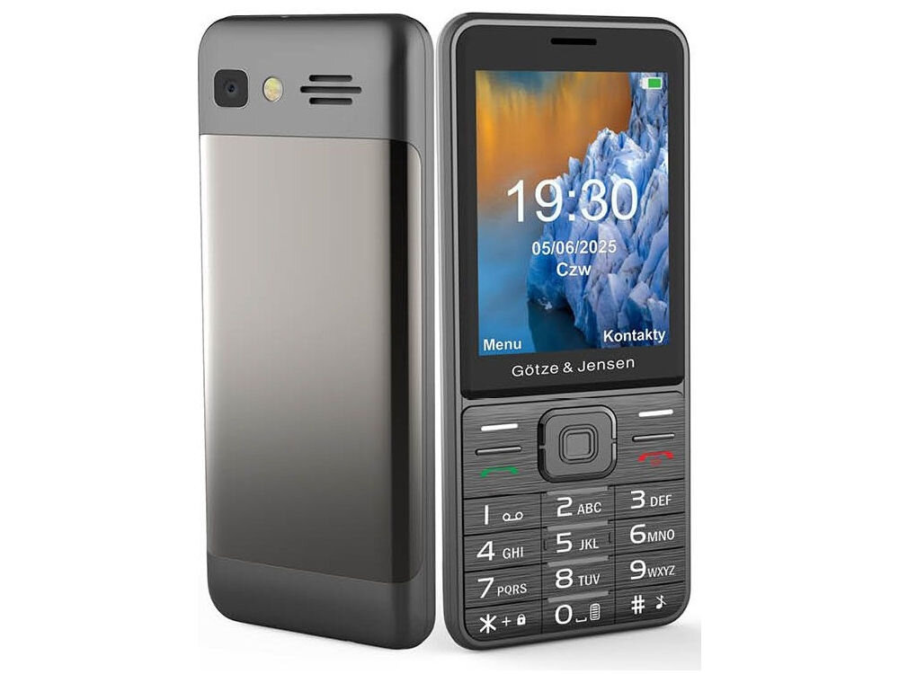 Na obrazie widoczny jest czarny telefon komórkowy z klawiaturą numeryczną i kolorowym wyświetlaczem, na którym widnieje godzina 19:30 oraz data 05/06/2025 Czw. Na obudowie telefonu znajduje się napis \'Götze & Jensen\'.