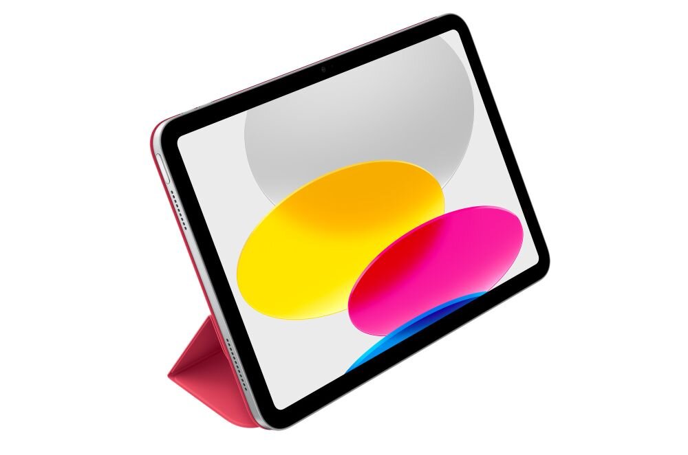Tablet w różowym etui stoi w pozycji pionowej. Na ekranie widoczne są kolorowe owalne kształty: żółty, różowy i niebieski.