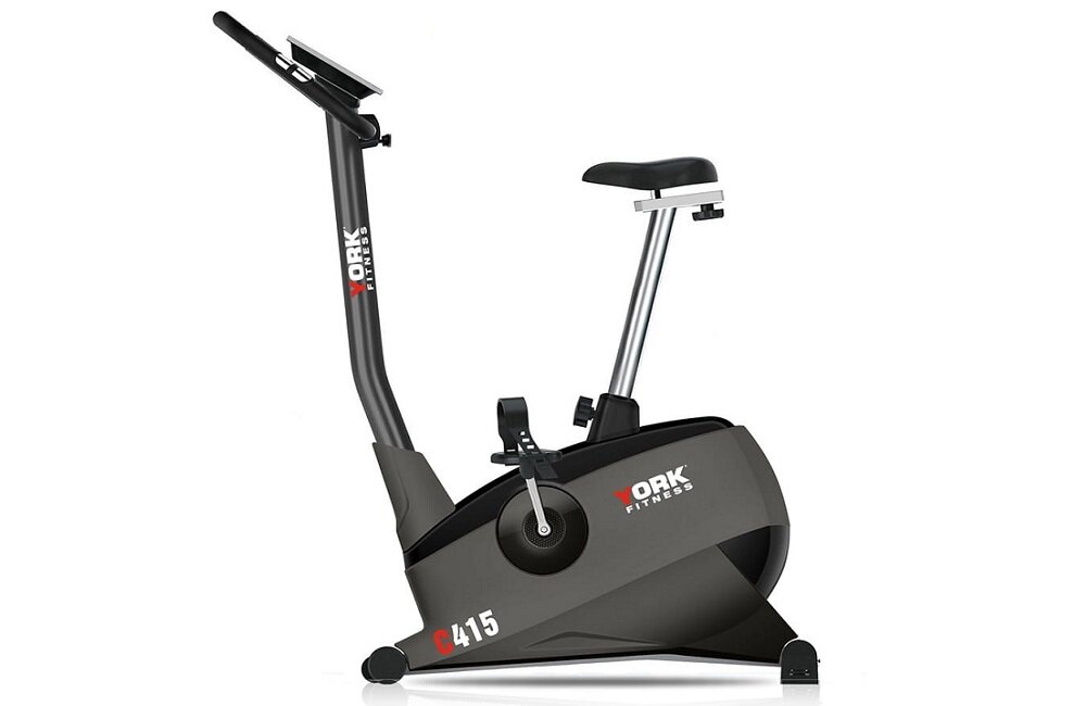 Na obrazie widoczny jest rower magnetyczny z napisem \'YORK FITNESS\' oraz oznaczeniem modelu \'C415\'. Rower ma ciemną kolorystykę z jasnymi akcentami na ramie i pedałach.