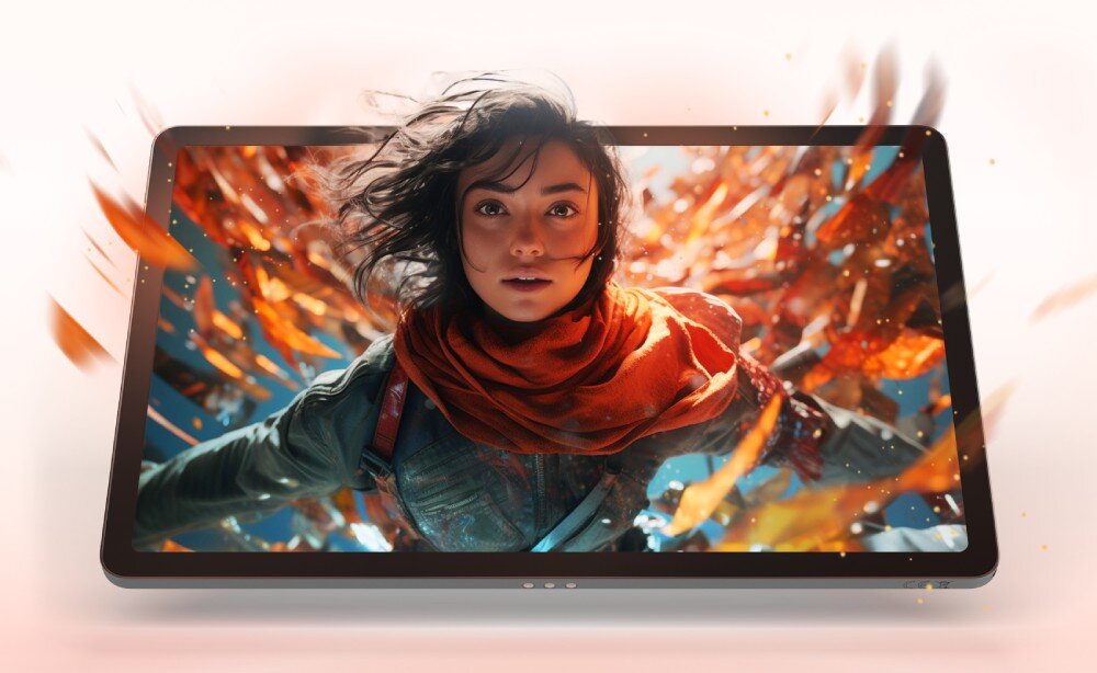 Tablet z wyświetlaczem prezentującym dynamiczną grafikę z postacią w czerwonym szaliku i unoszącymi się liśćmi. Obraz jest żywy i pełen ruchu, co podkreśla jakość ekranu urządzenia.