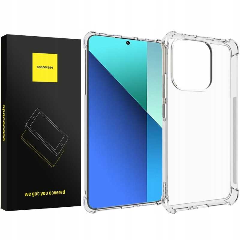 Przezroczyste silikonowe etui na telefon obok czarnego pudełka z żółtym logo \'spacecase\' i napisem \'we got you covered\'.