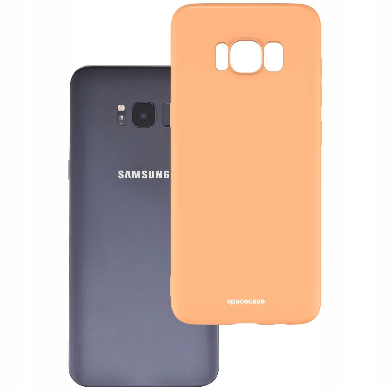 Na obrazie widoczne jest pomarańczowe silikonowe etui z napisem \'spacecase\', obok telefonu z napisem \'SAMSUNG\'.