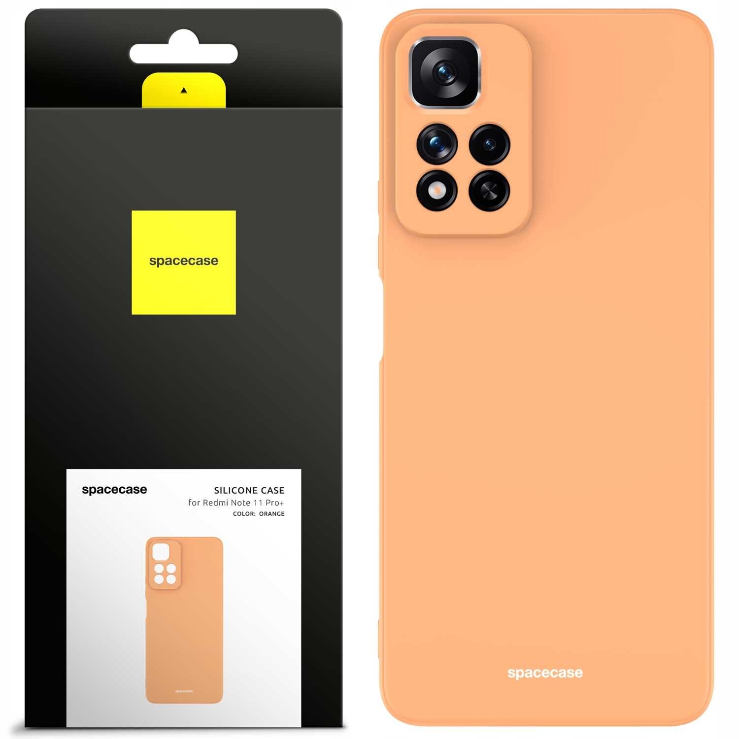 Pomarańczowe silikonowe etui na telefon z wycięciem na aparat, obok opakowanie z logo \'spacecase\'.