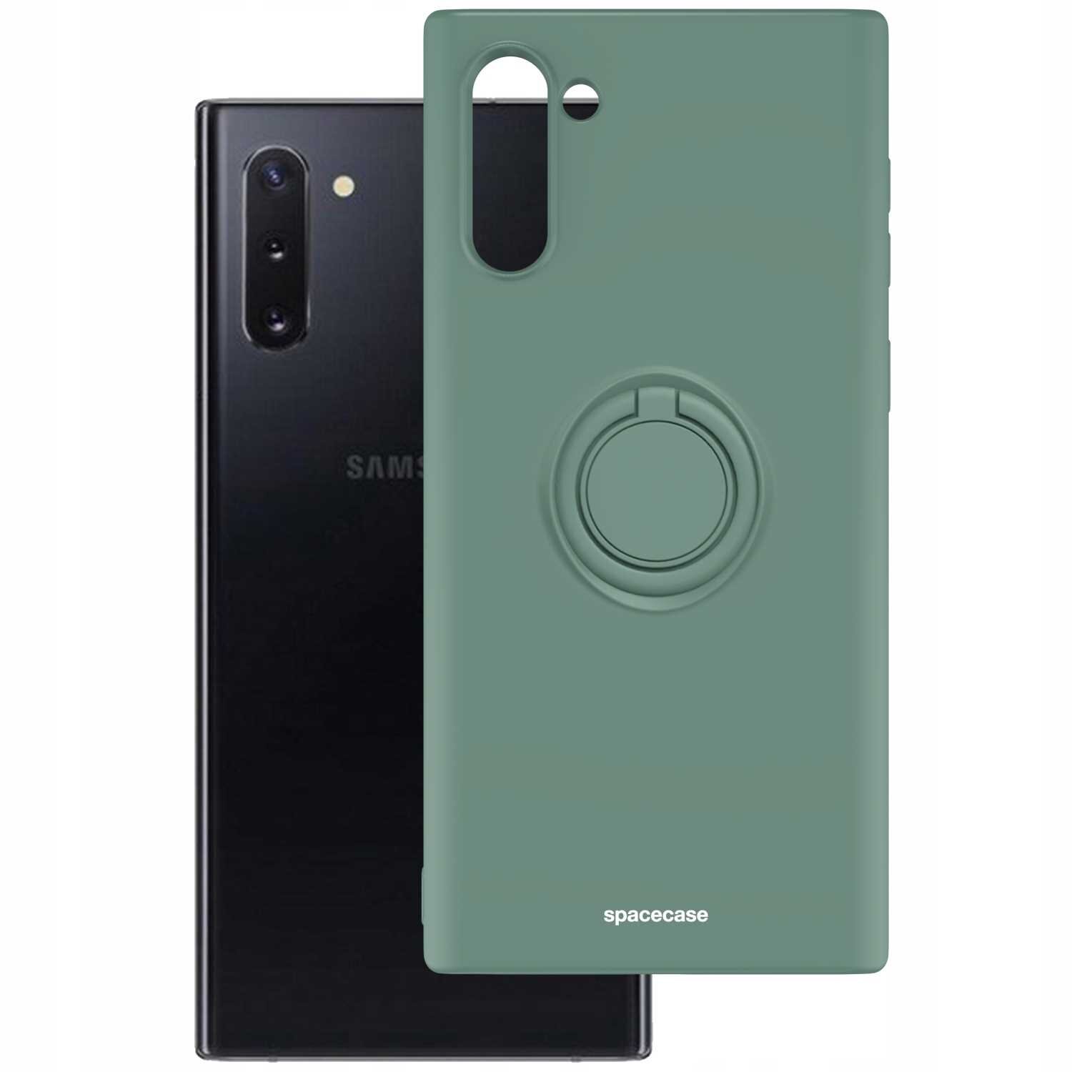 Zielone silikonowe etui z pierścieniem na tył telefonu, z wycięciami na aparat i logo \'spacecase\'. W tle widoczny jest czarny telefon z logo \'SAMSUNG\'.