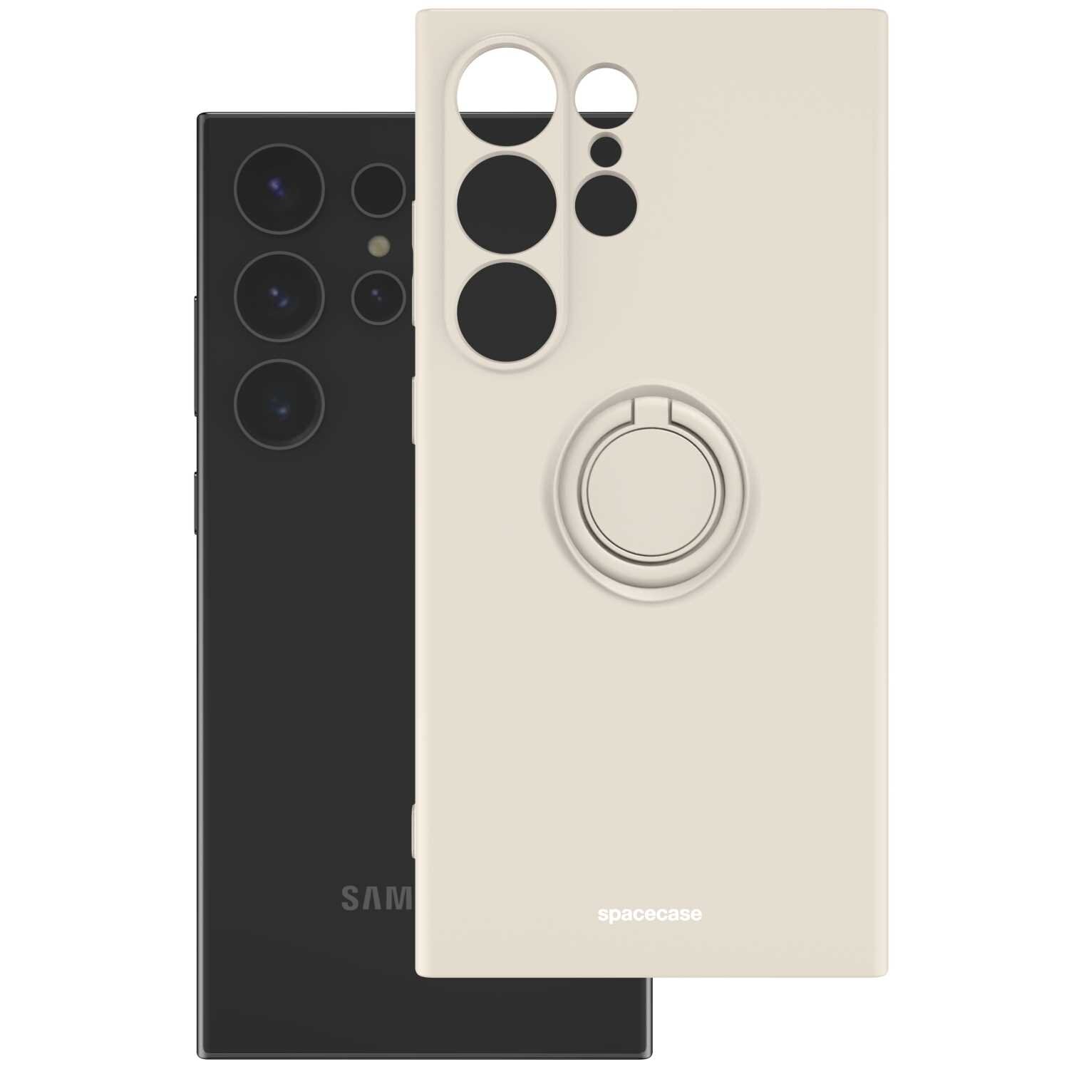 Beżowe silikonowe etui z pierścieniem, z wycięciami na aparat i logo \'spacecase\'. W tle widoczny czarny telefon z kilkoma obiektywami aparatu.