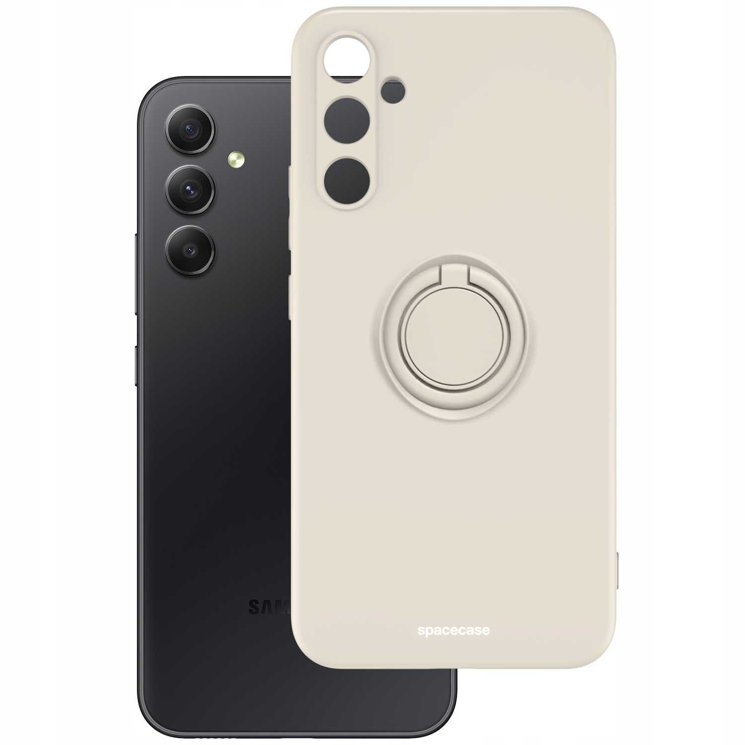 Na obrazie widoczne jest beżowe silikonowe etui z pierścieniem, obok czarnego smartfona z trzema aparatami. Na etui znajduje się napis \'spacecase\'.
