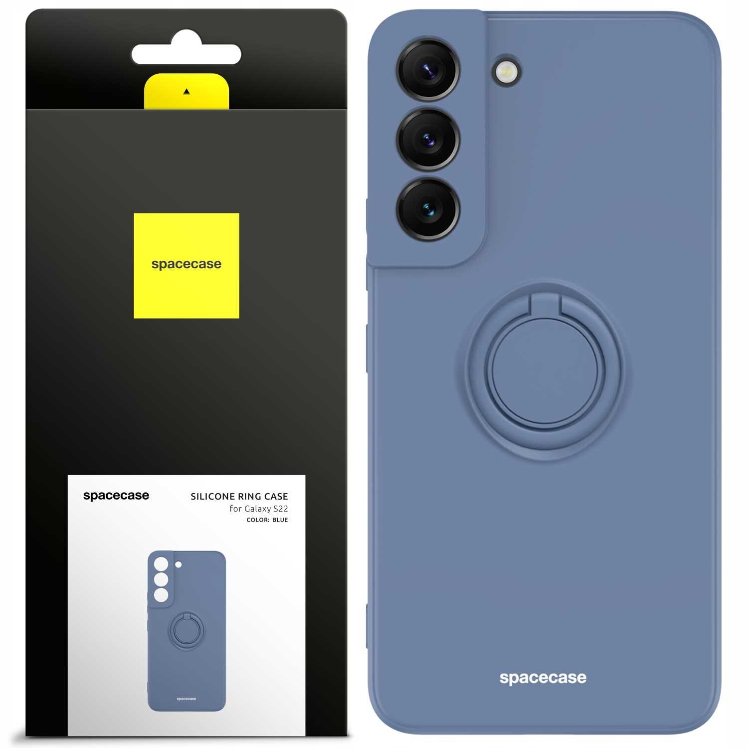 Na obrazie widoczne jest silikonowe etui w kolorze niebieskim z pierścieniem na tylnej stronie, przeznaczone do Galaxy S22. Obok znajduje się opakowanie z logo \'spacecase\' i opisem produktu.