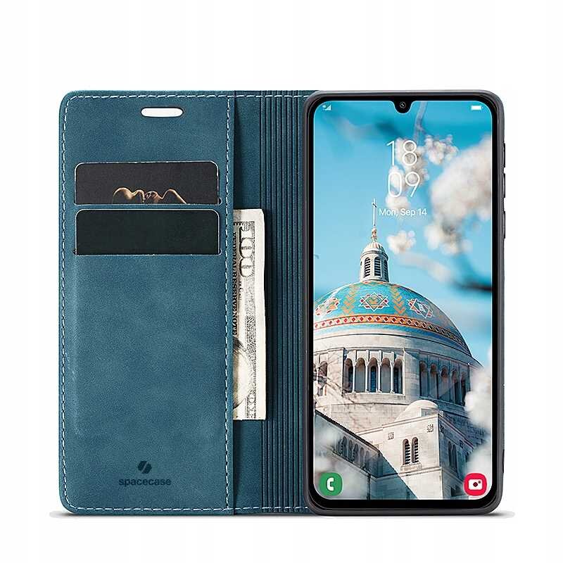 Etui z klapką w kolorze niebieskim z miejscem na karty i banknoty, obok którego znajduje się smartfon z wyświetlaczem pokazującym budynek z kopułą. Na etui widoczne jest logo \'spacecase\'.
