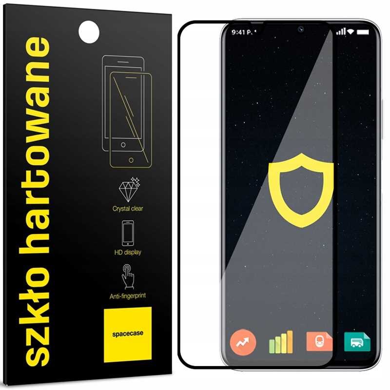 Opakowanie szkła hartowanego z napisem \'szkło hartowane\' oraz grafiką telefonu. Obok znajduje się telefon z nałożonym szkłem, na ekranie widoczna jest ikona tarczy.