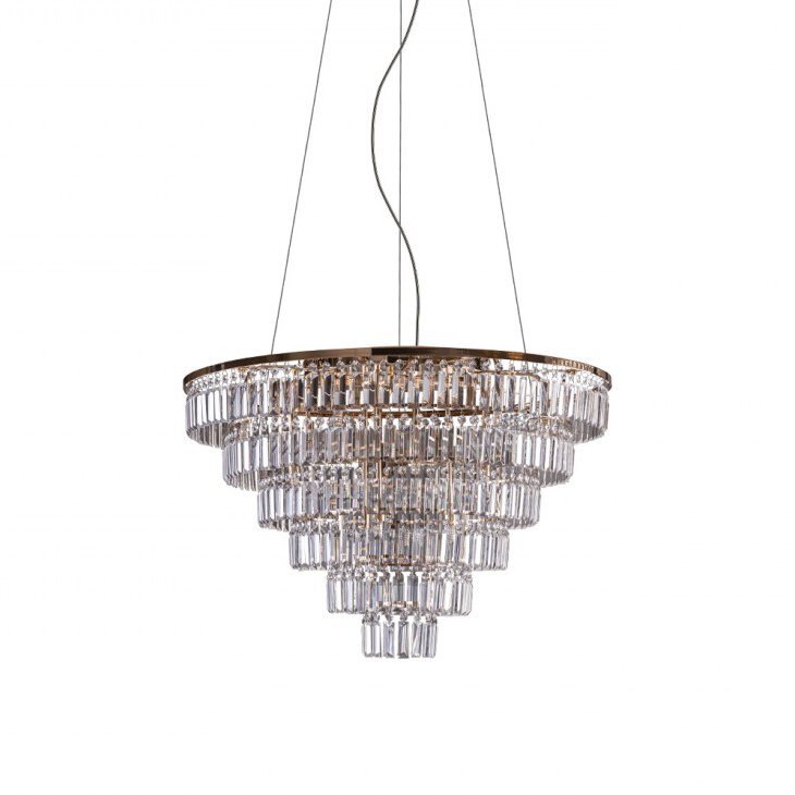 Lampa wisząca o nowoczesnym designie, składająca się z kilku poziomów przezroczystych kryształów ułożonych w kształt odwróconego stożka. Lampa zawieszona jest na cienkich, metalowych linkach.