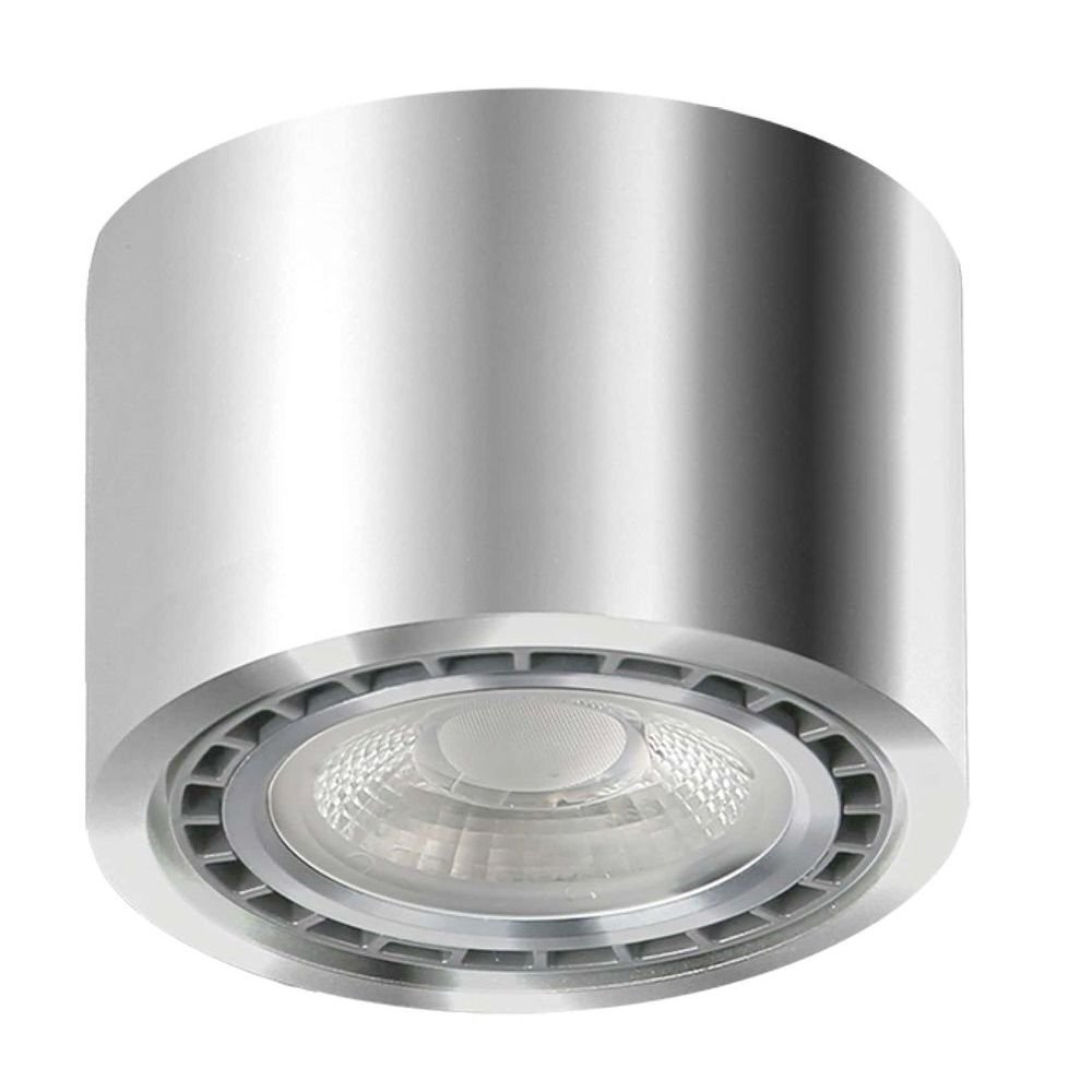 Srebrna, cylindryczna oprawa natynkowa z widocznym źródłem światła w środku. Lampa ma nowoczesny design z metalicznym wykończeniem.