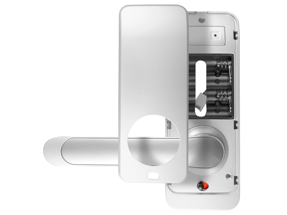 Srebrna klamka z widocznym mechanizmem wewnętrznym, w tym miejscem na baterie i otworem na klucz. Produkt ma prosty, nowoczesny design.