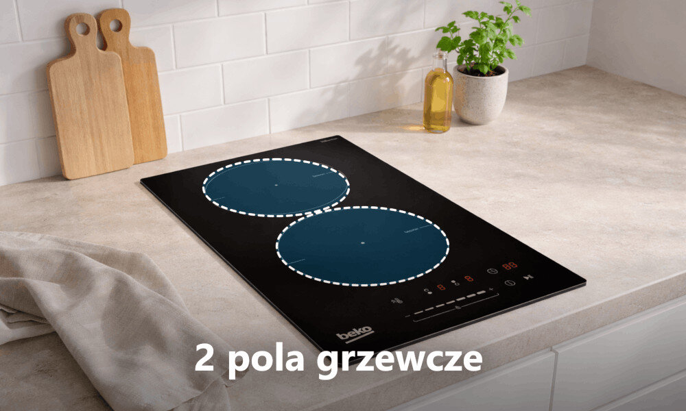Na blacie kuchennym znajduje się czarna płyta indukcyjna z dwoma zaznaczonymi polami grzewczymi. Widoczny jest napis \'2 pola grzewcze\' oraz logo \'beko\'.