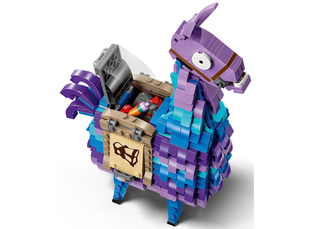 Model LEGO przedstawiający kolorową lamę z otwartym bokiem, ukazującym różne akcesoria w środku. Llama jest zbudowana z klocków w odcieniach fioletu, niebieskiego i turkusu.