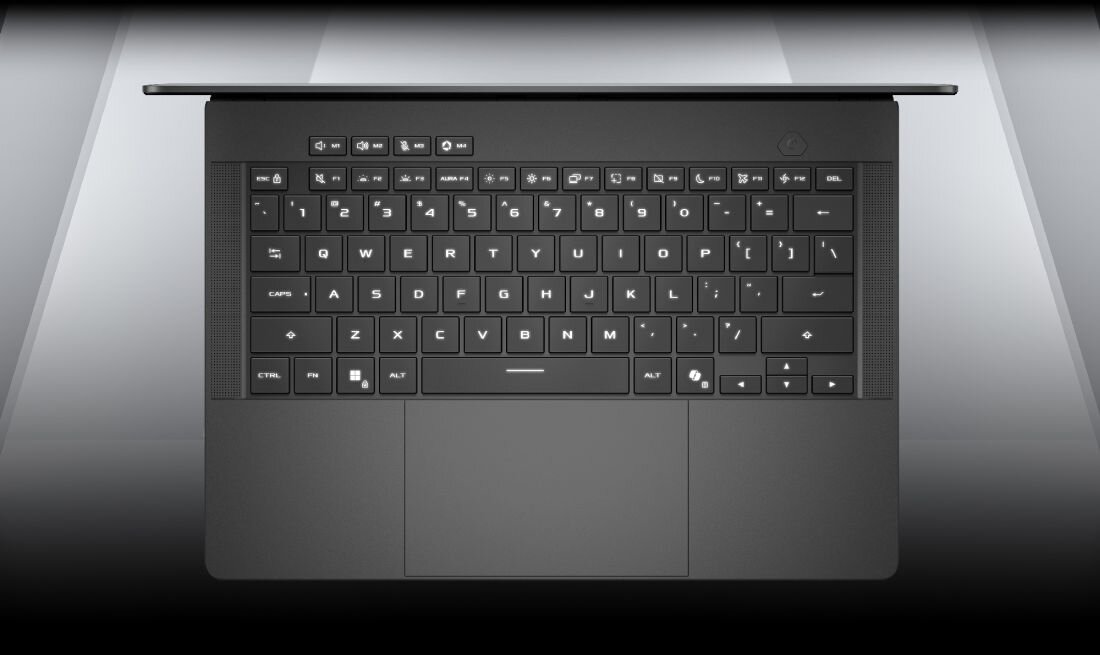 Laptop ASUS ROG Zephyrus z podświetlaną klawiaturą prezentuje układ klawiszy i touchpad podczas pracy oraz rozgrywki gamingowej