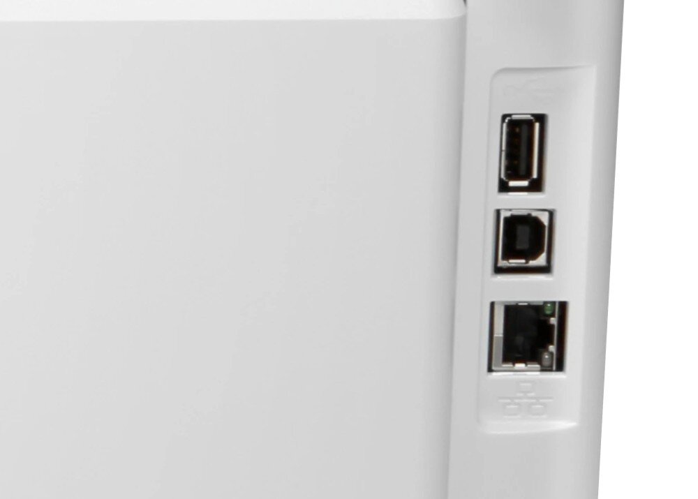 Fragment urządzenia z trzema portami: USB, Ethernet i innym złączu. Obudowa jest w kolorze białym.