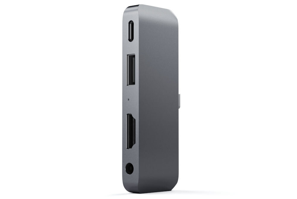 Szary hub USB typu C z kilkoma portami, w tym USB, HDMI i gniazdem audio. Produkt ma nowoczesny, minimalistyczny design.