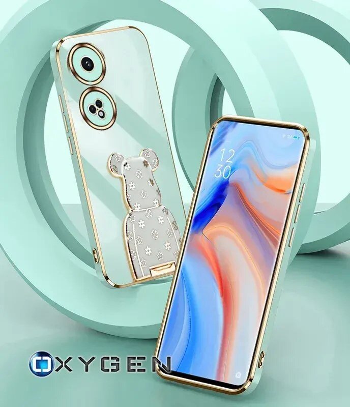 Na obrazie widoczne są dwa telefony w etui z motywem misia i logo OXYGEN. Tło jest w odcieniach mięty z geometrycznymi kształtami.