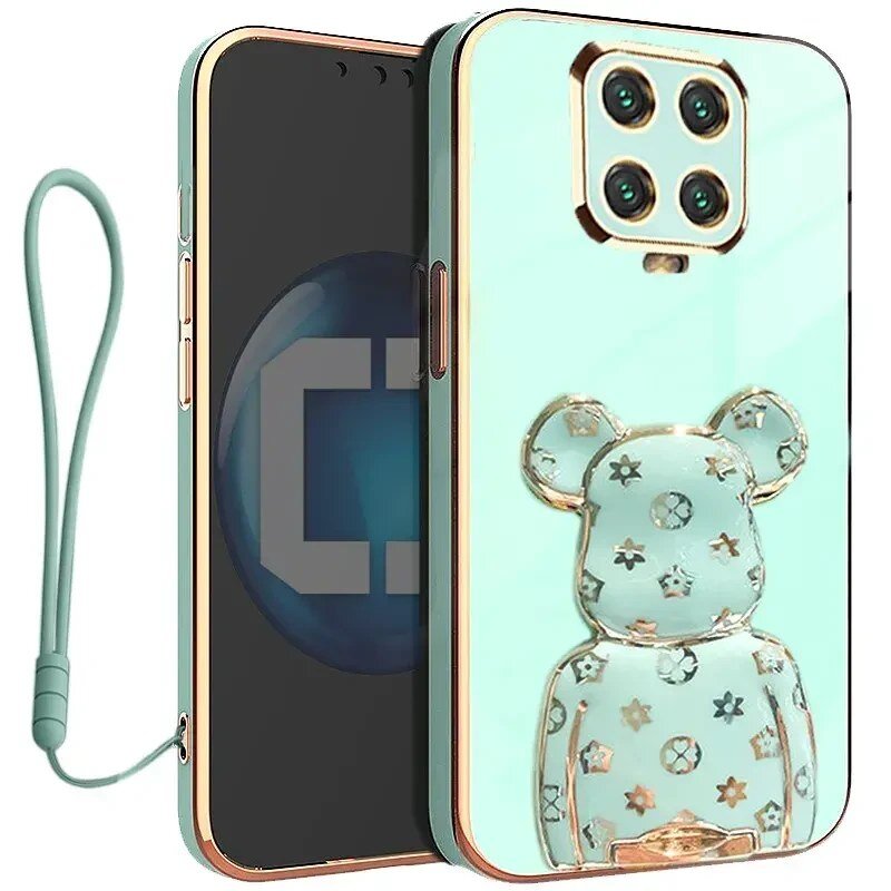 Etui na telefon w kolorze miętowym z przezroczystym uchwytem w kształcie misia ozdobionym gwiazdkami i kółkami. Do etui dołączona jest smycz w tym samym kolorze.