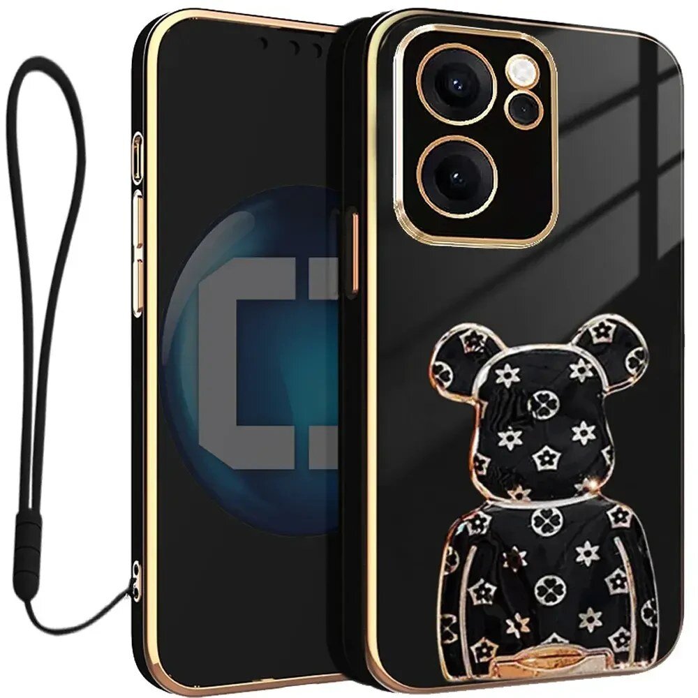 Czarne etui na telefon z ozdobnym wzorem misia w białe gwiazdki i kwiatki, posiada złote wykończenia wokół aparatu. Do etui dołączona jest czarna smycz.