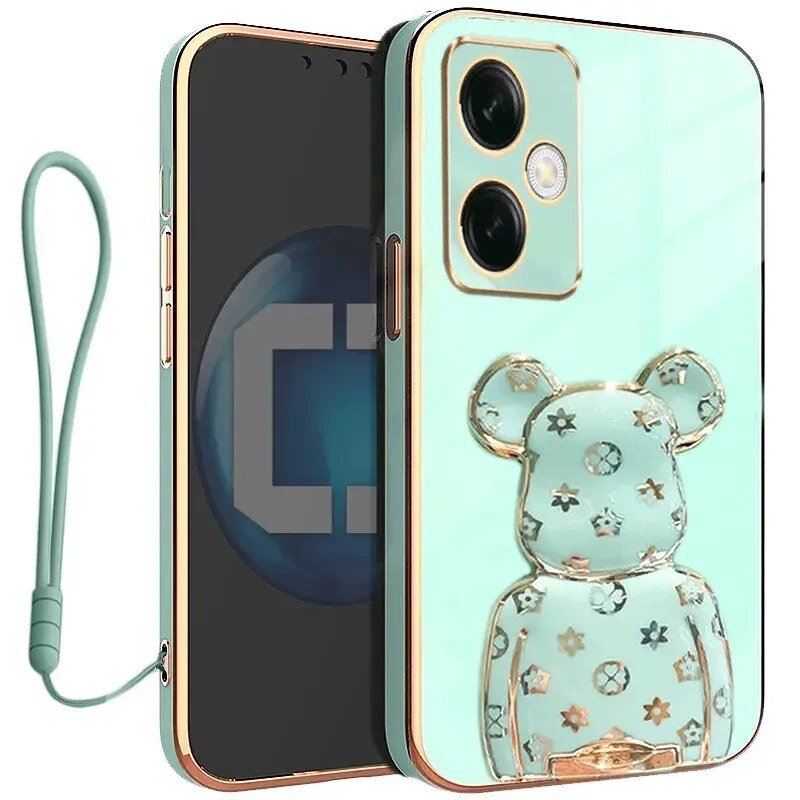 Etui na telefon w kolorze miętowym z motywem misia i złotymi elementami, posiada dwa otwory na aparat. Do etui dołączona jest smycz w dopasowanym kolorze.