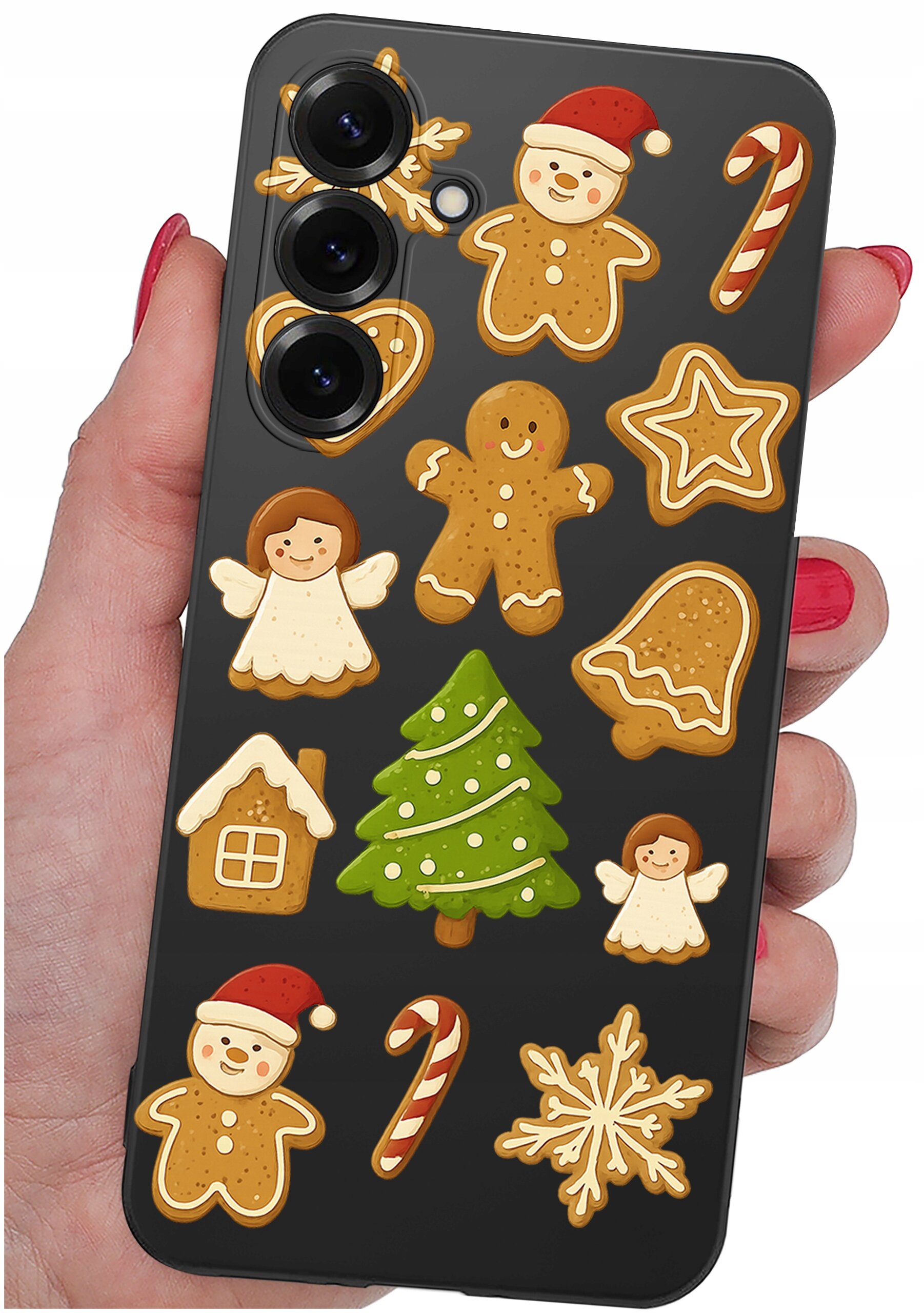 Etui na telefon z motywem świątecznych pierników, w tym ludziki, choinka, aniołki i laski cukrowe. Etui jest trzymane w dłoni z pomalowanymi na czerwono paznokciami.