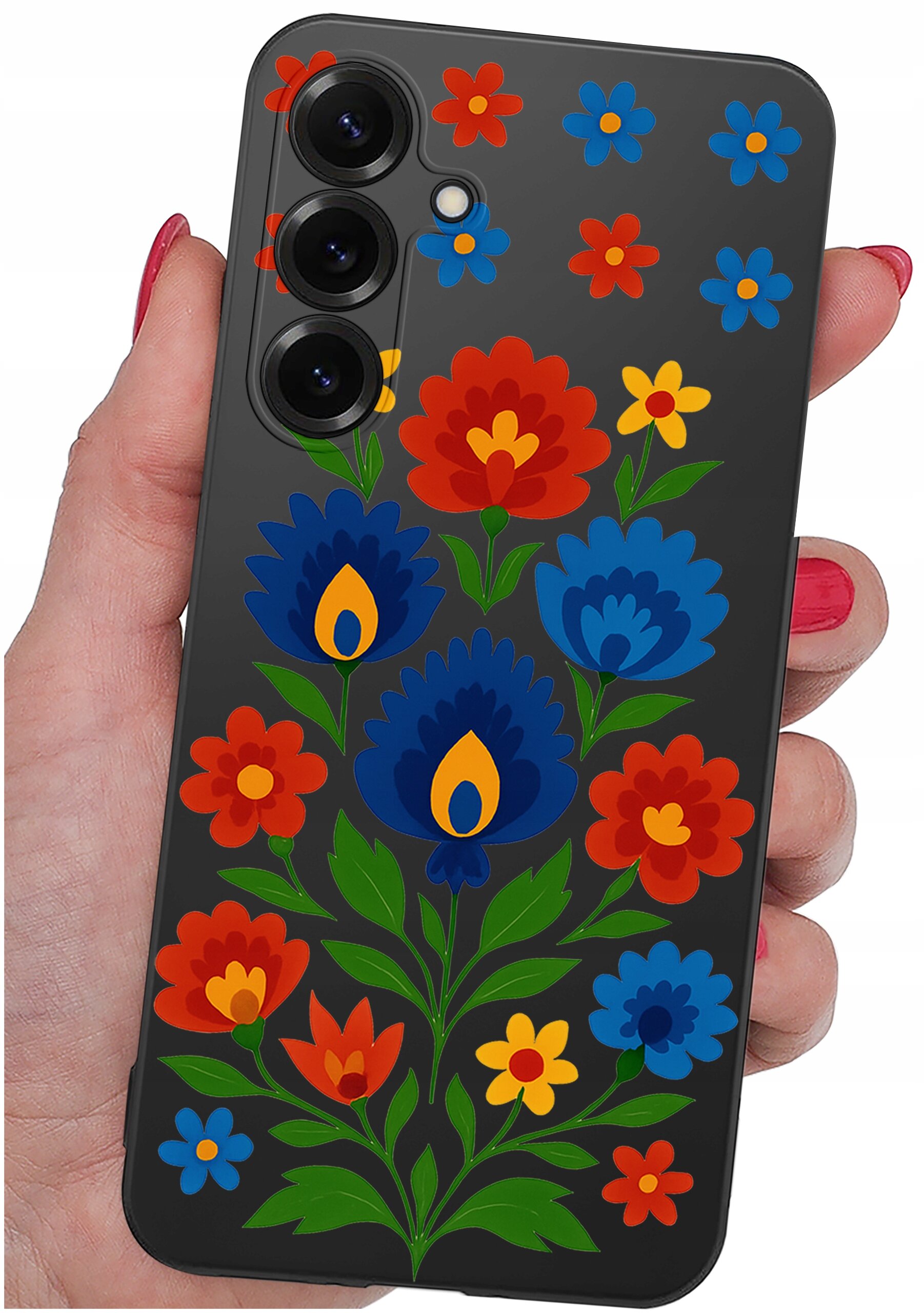 Etui na telefon z kolorowym wzorem kwiatowym w odcieniach czerwieni, niebieskiego i żółtego, trzymane w dłoni. Widoczne są trzy obiektywy aparatu na górze etui.