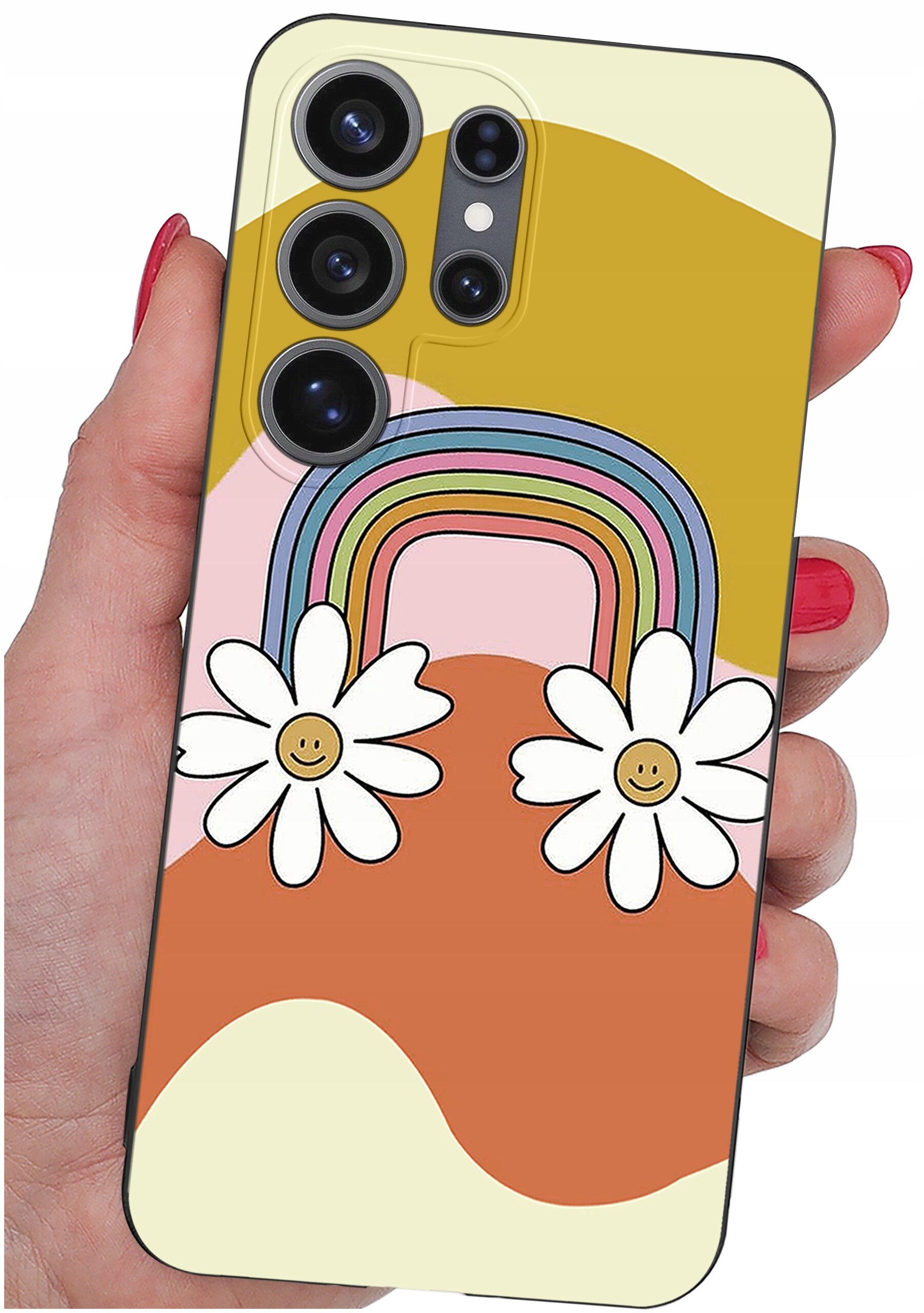 Etui na telefon z kolorowym wzorem tęczy i dwoma kwiatami z uśmiechniętymi buźkami. Etui trzymane jest w dłoni z pomalowanymi na czerwono paznokciami.