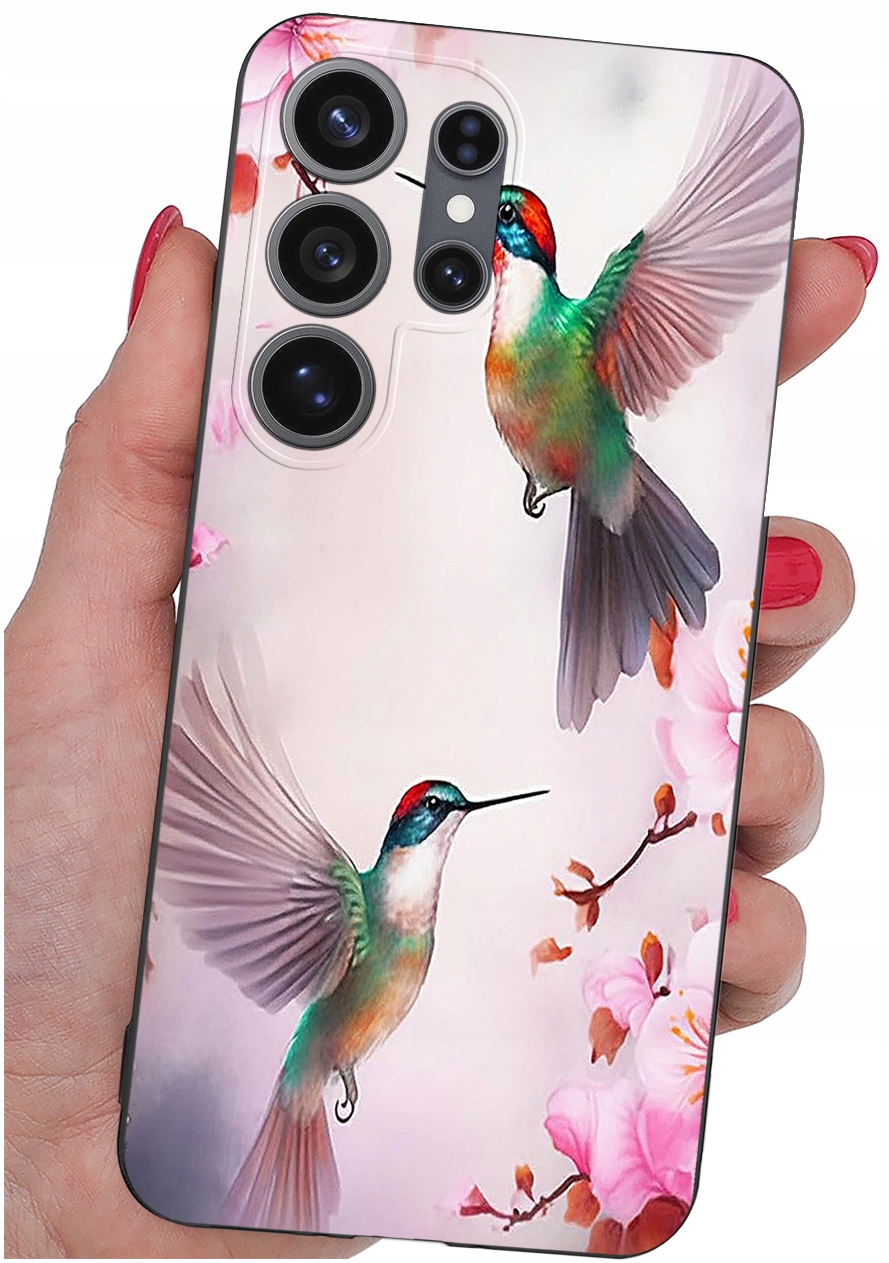 Etui na telefon z kolorowym wzorem przedstawiającym dwa kolibry wśród różowych kwiatów. Etui jest trzymane w dłoni, a na górze widoczne są otwory na aparat.