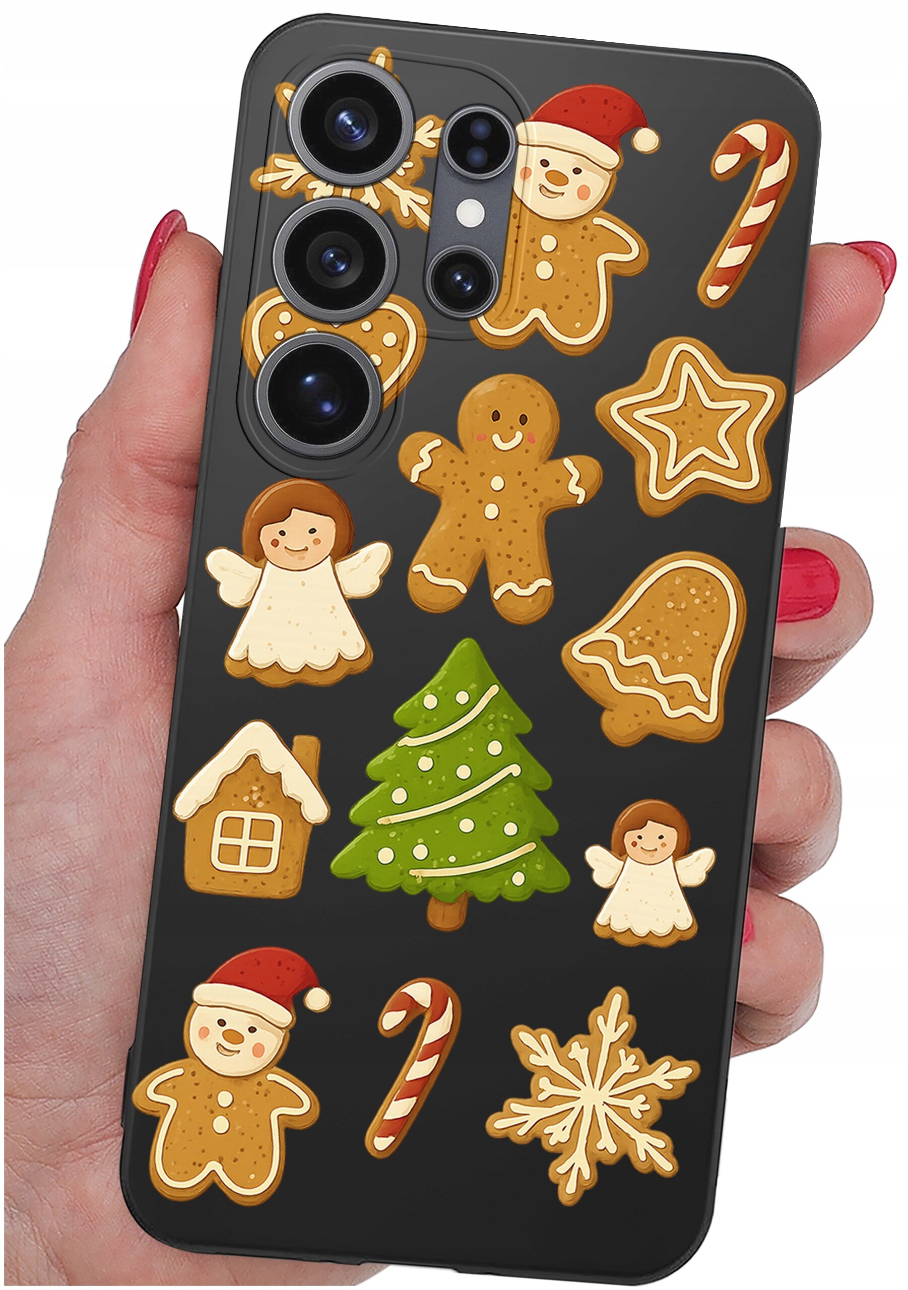 Etui na telefon z motywem świątecznych pierników, w tym choinki, aniołków i laski cukrowej, trzymane w dłoni z czerwonymi paznokciami.