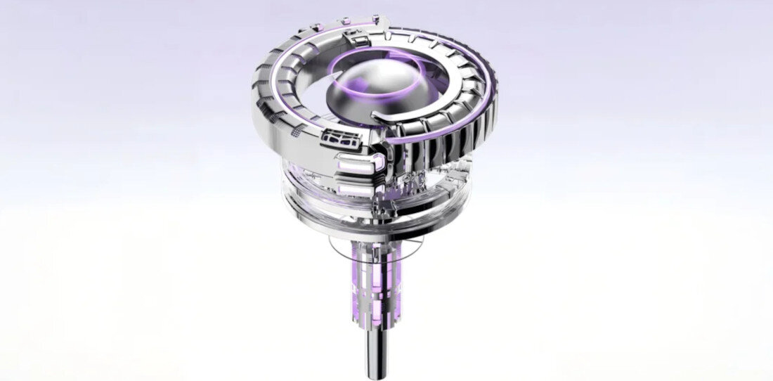 Obraz przedstawia metalowy, cylindryczny element z przezroczystymi i fioletowymi akcentami, przypominający część mechanizmu lub urządzenia.