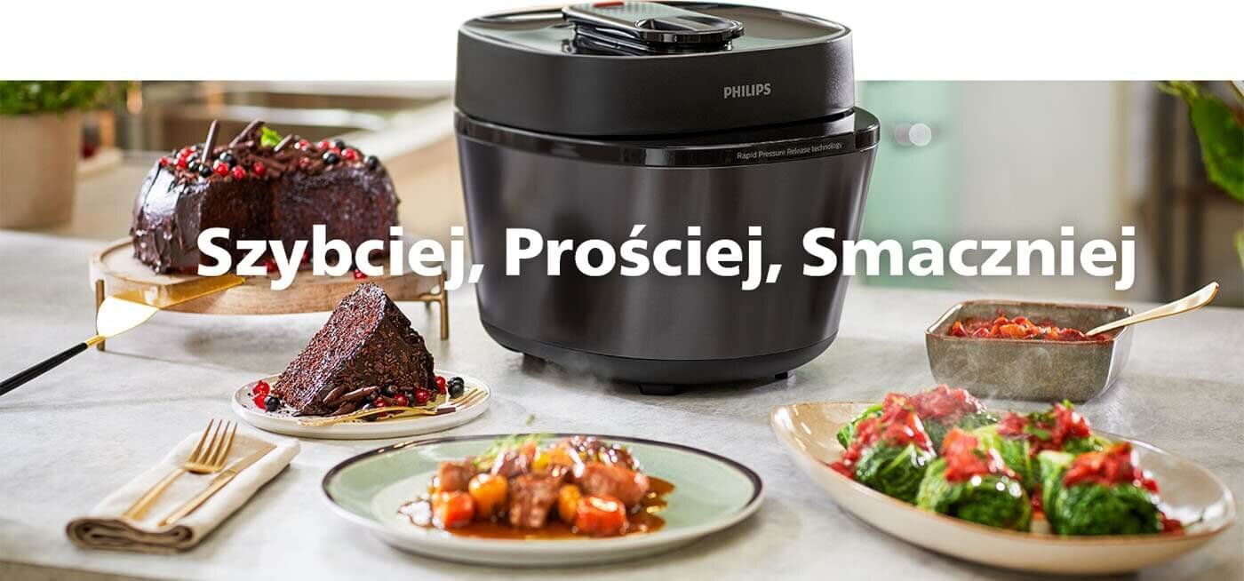 Na obrazie widoczny jest multicooker marki PHILIPS z napisem \'Szybciej, Prościej, Smaczniej\'. Wokół urządzenia znajdują się talerze z różnymi potrawami.