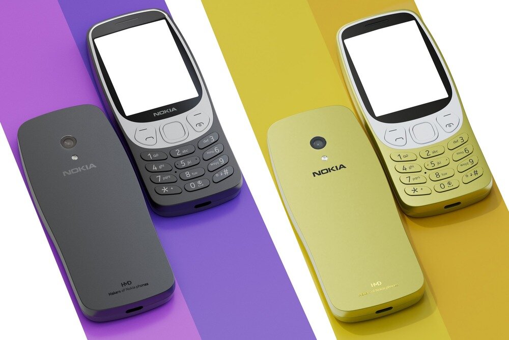 Na obrazie widoczne są dwa telefony komórkowe marki Nokia, jeden w kolorze czarnym, drugi złotym. Oba telefony mają klasyczny design z klawiaturą numeryczną i logo Nokia na obudowie.