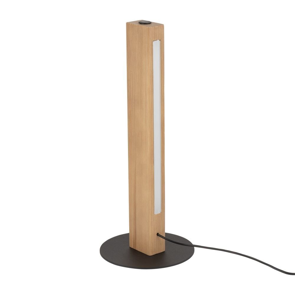 Lampa stołowa o prostokątnym kształcie z drewnianym wykończeniem, umieszczona na okrągłej, czarnej podstawie. Z lampy wychodzi czarny przewód zasilający.