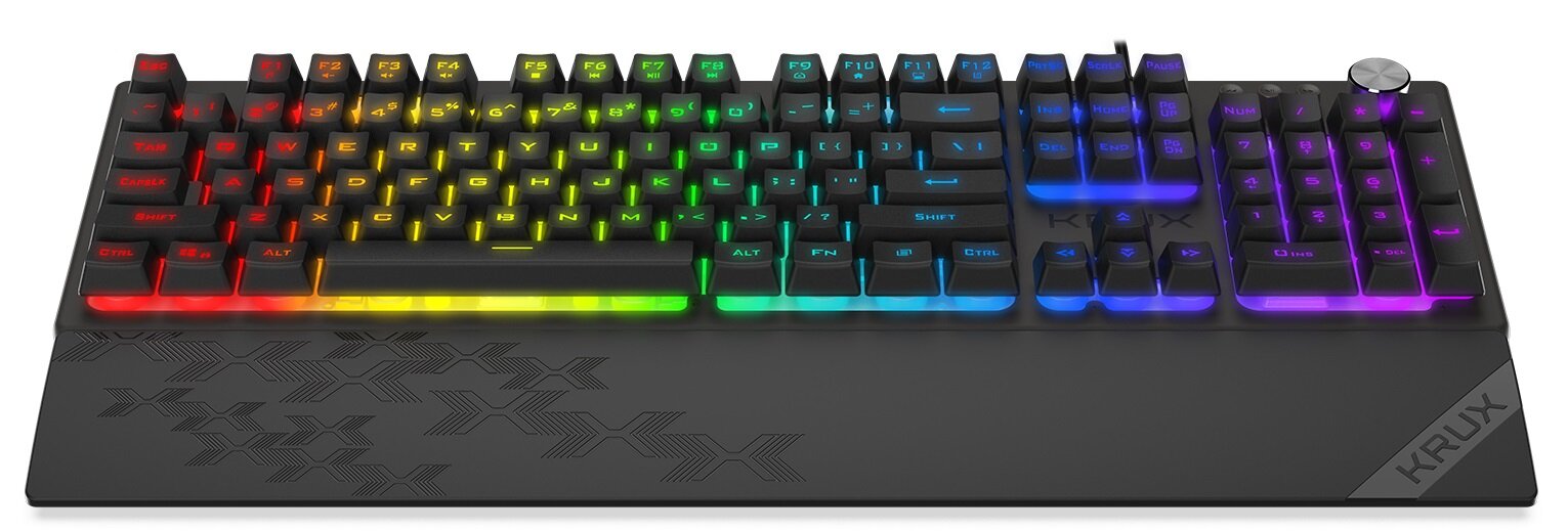 Klawiatura mechaniczna z podświetleniem RGB, posiadająca klawisze w różnych kolorach tęczy. Na dolnej części widoczny jest wzór oraz napis \'KRUX\'.
