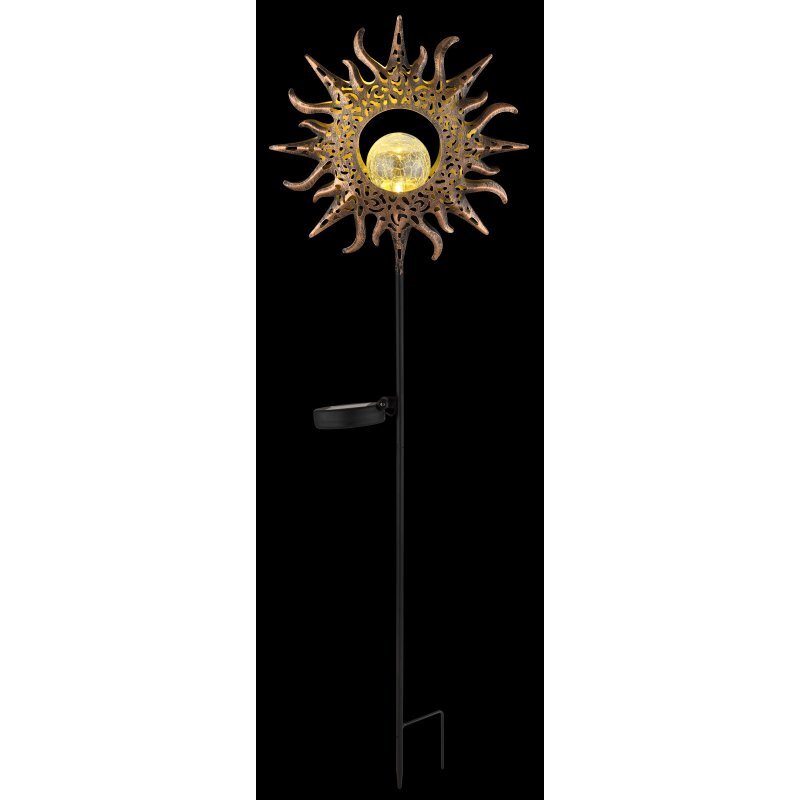 Lampa solarna z dekoracyjnym wzorem przypominającym słońce, z centralnie umieszczoną kulą emitującą światło. Lampa jest zamontowana na długim, czarnym pręcie z uchwytem do wbicia w ziemię.