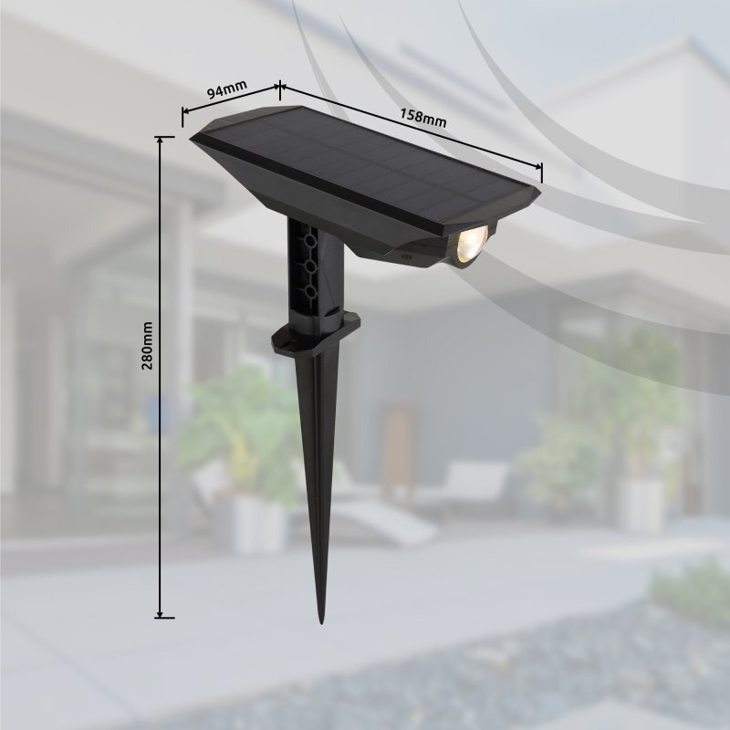 Na obrazie widoczna jest czarna lampa solarna z panelem słonecznym i reflektorem, zamocowana na szpikulcu do wbicia w ziemię. Obok lampy znajdują się wymiary: 94mm, 158mm i 280mm.
