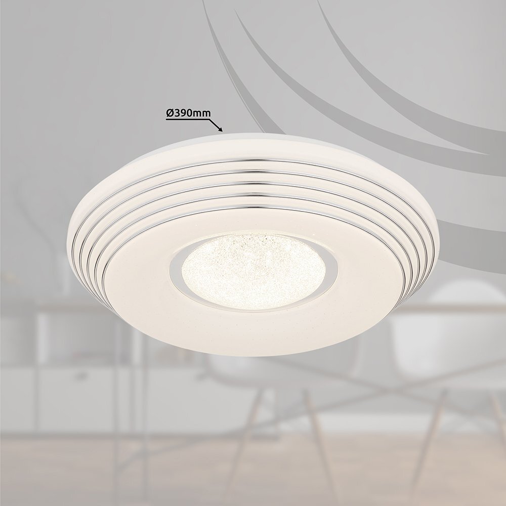 Biała lampa sufitowa LED o średnicy 390 mm z okrągłym, dekoracyjnym wzorem na powierzchni. W tle widoczny jest rozmyty obraz wnętrza mieszkalnego.